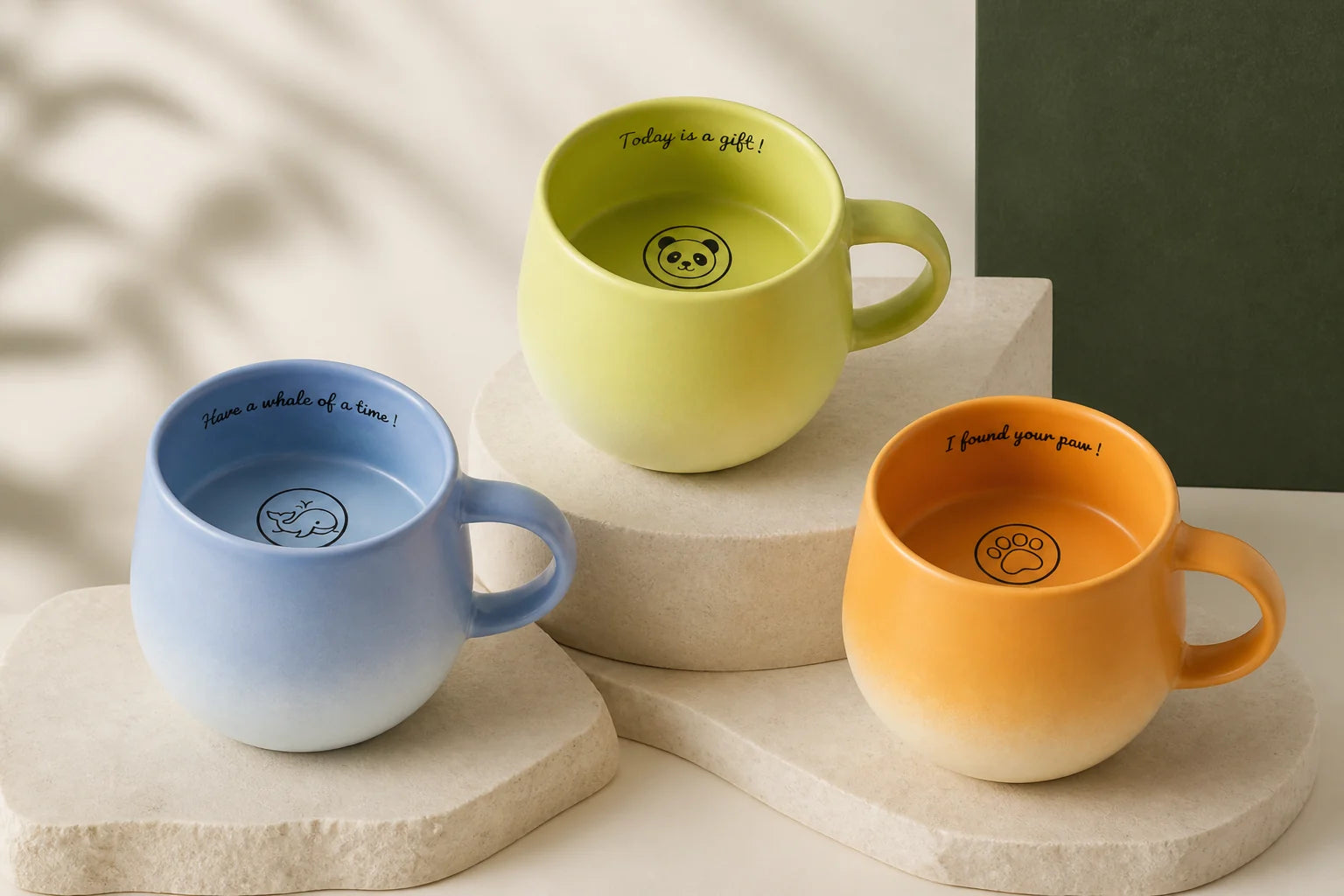 Green, blue, and yellow Urboria Orivon surprise mugs displayed as a coordinated collection