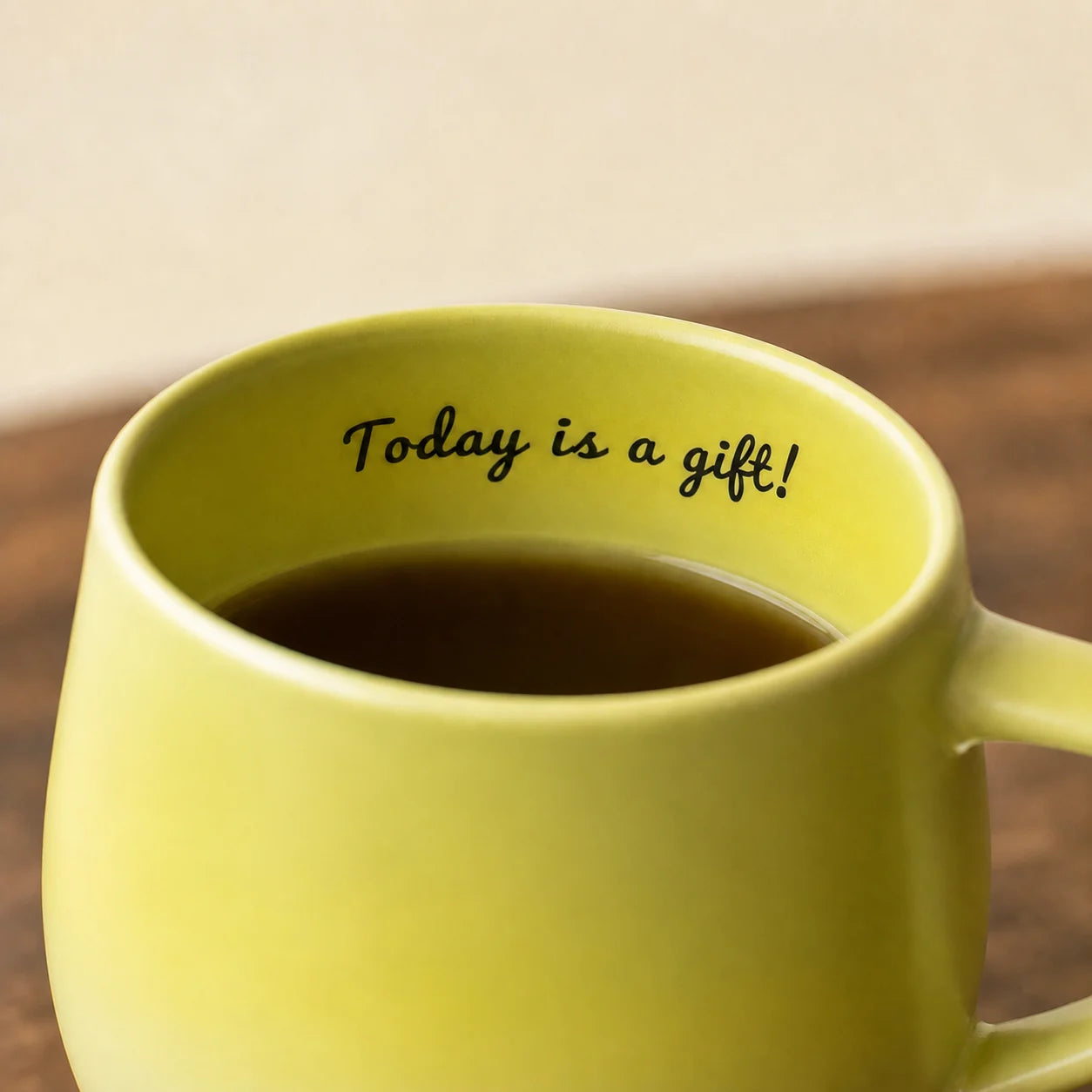 Encouraging message printed along the inside rim of the green panda mug