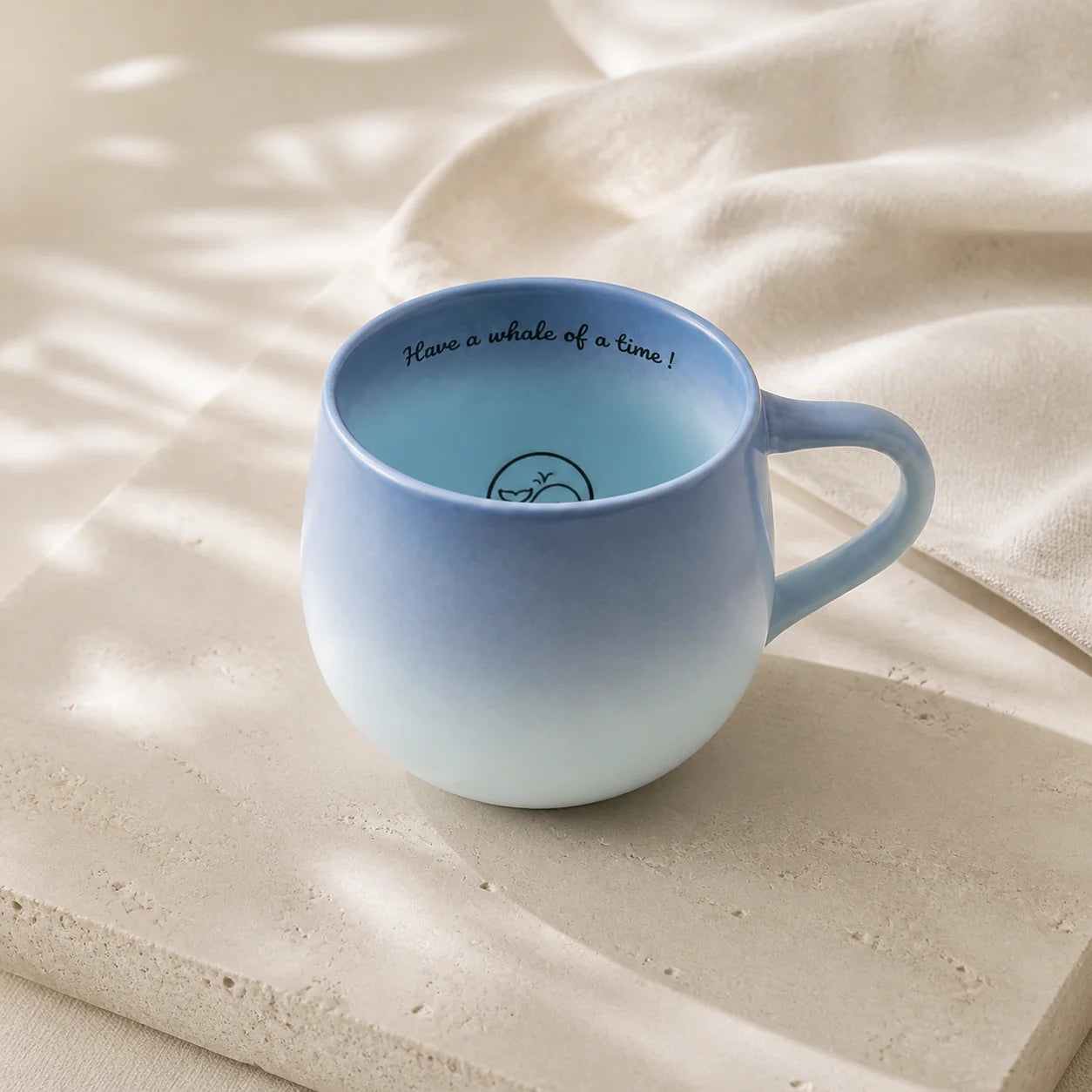 Blue Whale mug showing its playful inner-rim message and hidden whale illustration